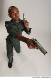 ERIC KNEELING POSE WITH GUNS